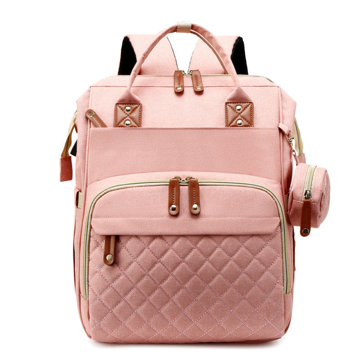Kompakter Babyrucksack mit aufklappbarem Wickelbett. Dein platzsparender Reiserucksack für Baby & Kinderzubehör.