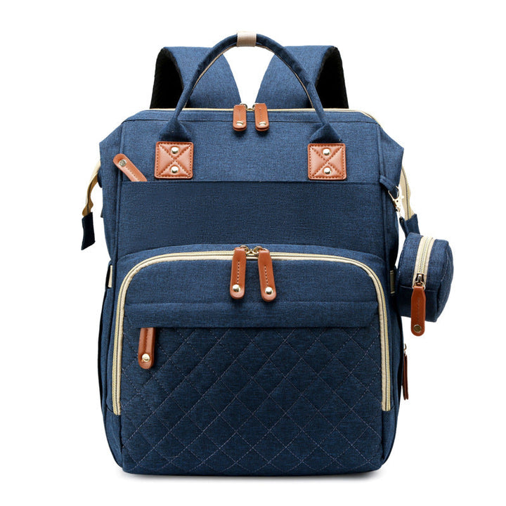 Babyrucksack 2-in-1 geöffnet, mit Blick auf das organisierte Innenleben. Alles griffbereit für dein Babyzubehör.