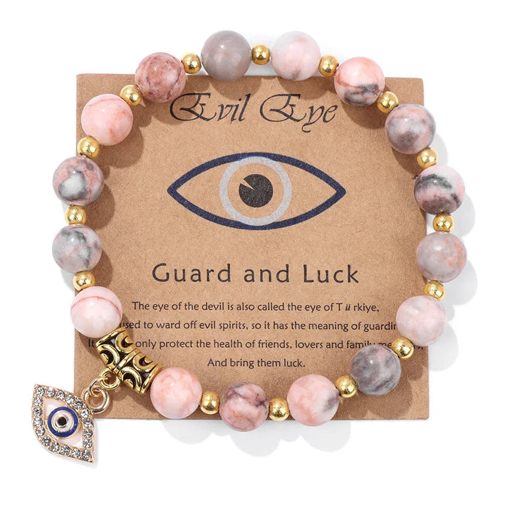 Symbolisches Perlenarmband: Böses-Auge Anhänger als Schutz vor Unglück. Spiritueller Schmuck für den Alltag.