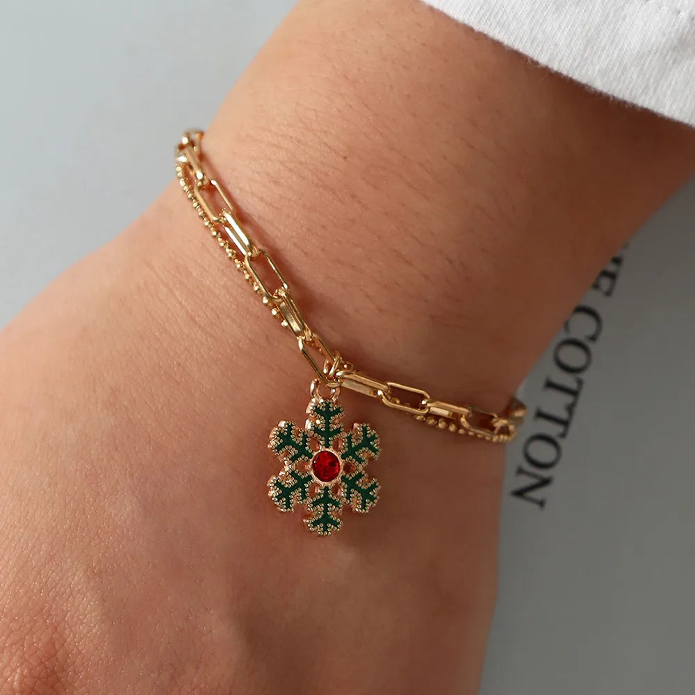 Damen Winterzauber Charme Armband mit festlichen Weihnachts-Anhängern, ideales Geschenk.