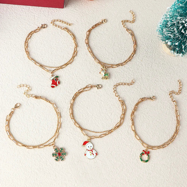 Weihnachtsgeschenk für Damen: Zauberhaftes Winter Charme Armband mit festlichen Motiven.