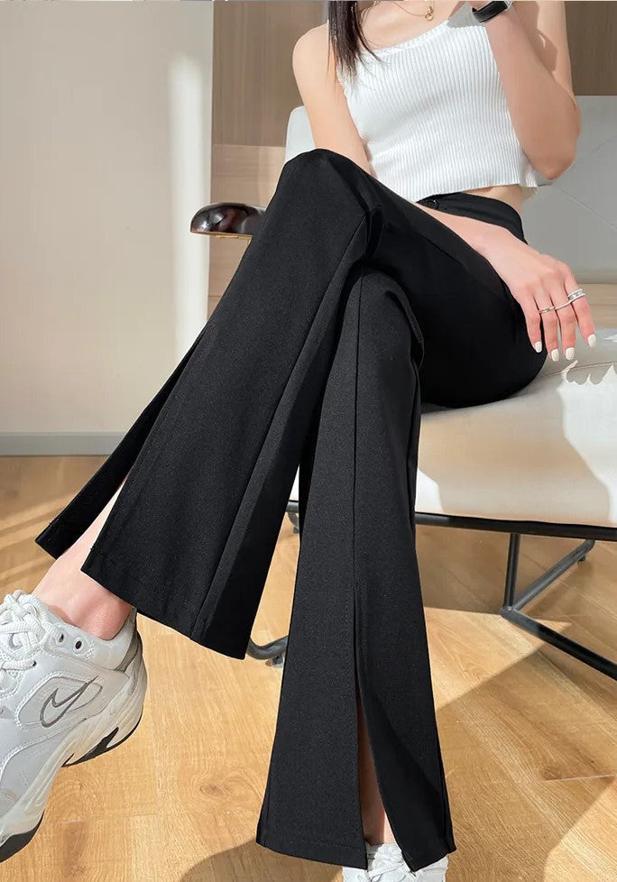 Vielseitige schwarze Damenhose, Übergröße, mit Schlag und modischem Schlitz, ganzjährig tragbar.