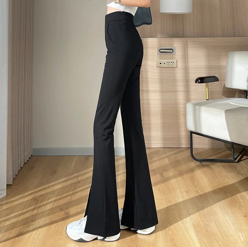 Schwarze elegante Plus Size Schlaghose für Damen mit hoher Taille und modischem Schlitz-Detail.