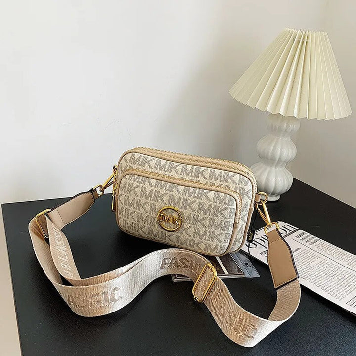 Luxuriöse braune Damen Handtasche mit Crossbody-Gurt. Stilvolles Accessoire in edler Leder-Optik für Frauen.