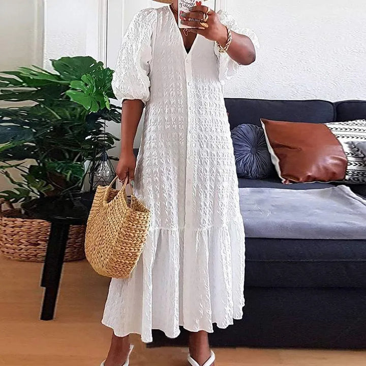 Schmeichelndes Damen Maxikleid in Übergröße, kurvenbetonend, mit V-Ausschnitt und stilvollen Puffärmeln.