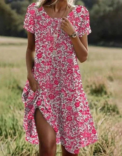 Seitliche Ansicht des locker fallenden Damen Blumen Midi-Kleides, ideal als Sommer-Freizeitkleid.