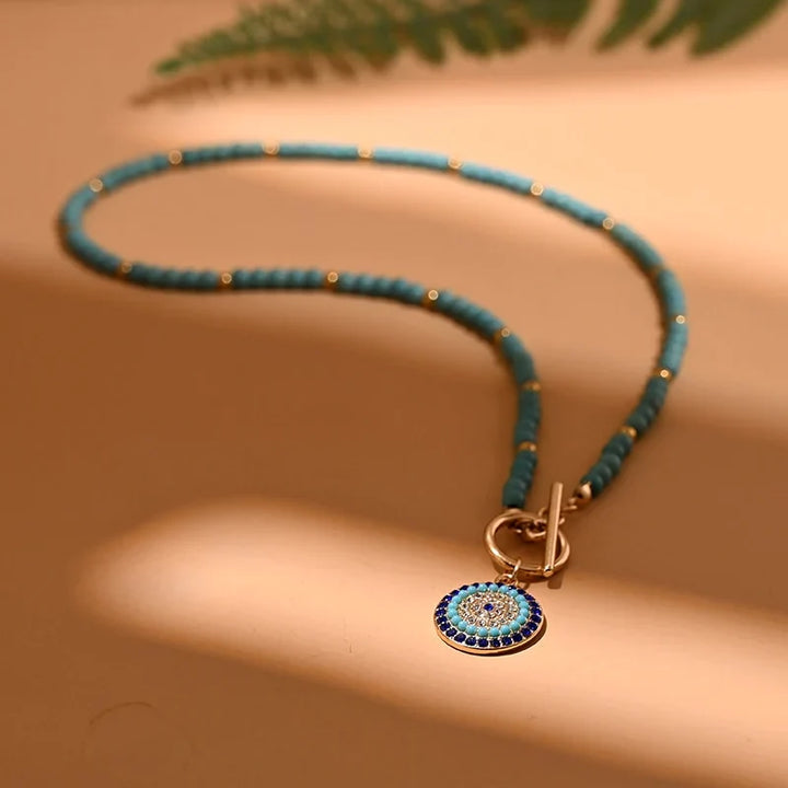 Trendige Damen Perlen-Choker-Halskette mit Evil Eye Motiv. Boho-Schmuck für Frauen.