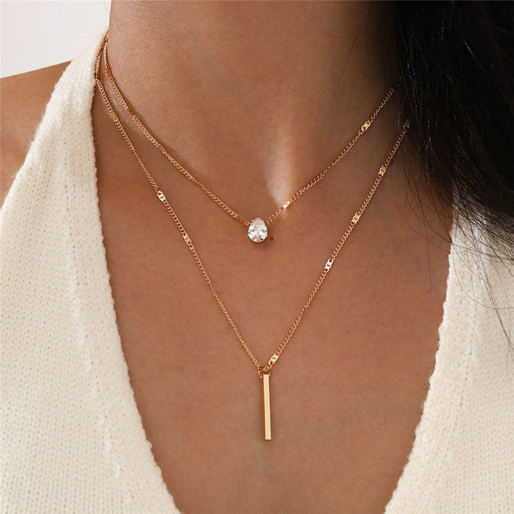 Gold-Halskette Set für Damen mit mehreren Gliederketten und Anhängern. Eleganter Vintage-Look.