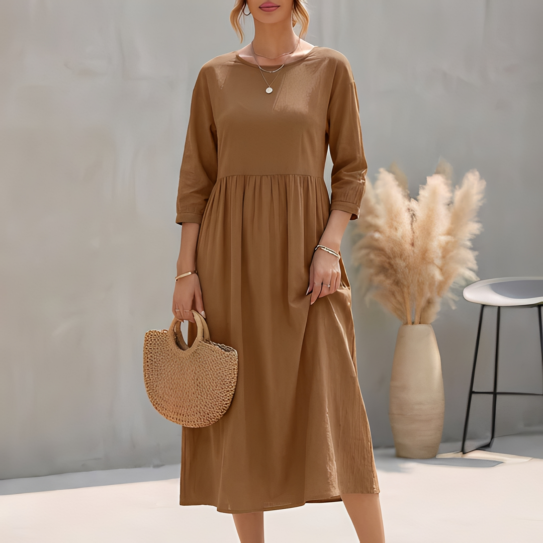 Bequemes Damen Midi Sommerkleid mit 3/4-Ärmeln, Empire-Taille und Seitentaschen für Frühling & Sommer.