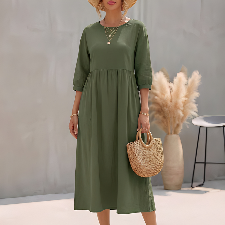 Damen Midi-Kleid in A-Linie mit Empire-Taille, praktischen Seitentaschen und bequemen 3/4-Ärmeln.