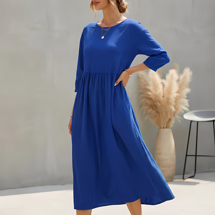 Modisches Damen Sommerkleid, Midi-Länge, mit schmeichelhafter Empire-Taille und praktischen Seitentaschen.
