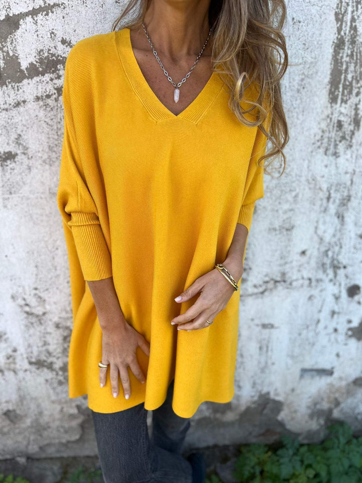 Damen Oversize Sweatshirt mit V-Ausschnitt und feinen Rippdetails. Bequemer Pullover mit 3/4 Arm für jeden Tag.