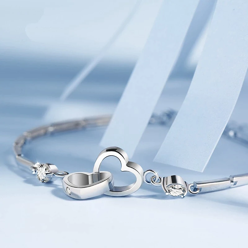 Hochwertiges 925er Silberarmband für Damen mit filigranem Doppelherz-Design; stilvolles Schmuck-Accessoire.