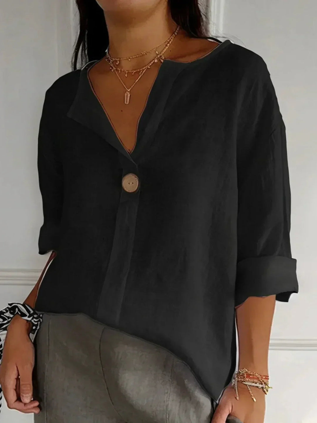 Lockeres Damen V-Ausschnitt Oberteil, bequeme Passform für lässige Anlässe oder elegante Büro-Looks.