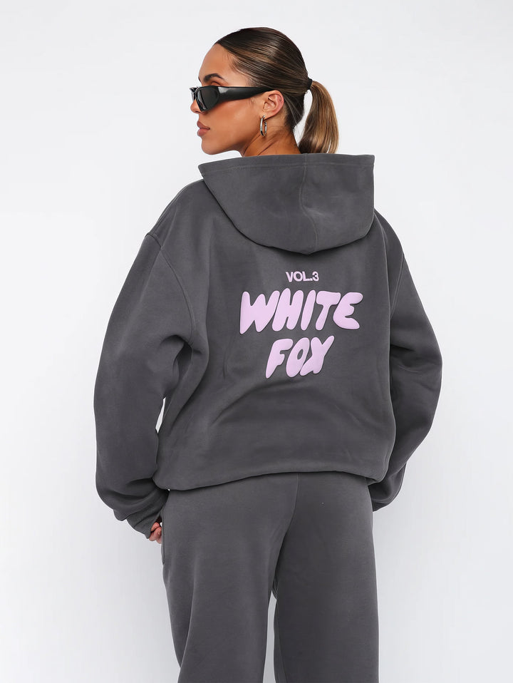 Details: Damen Freizeit-Hoodie des trendigen Trainingsanzugs mit Kapuze und Zugbändern.