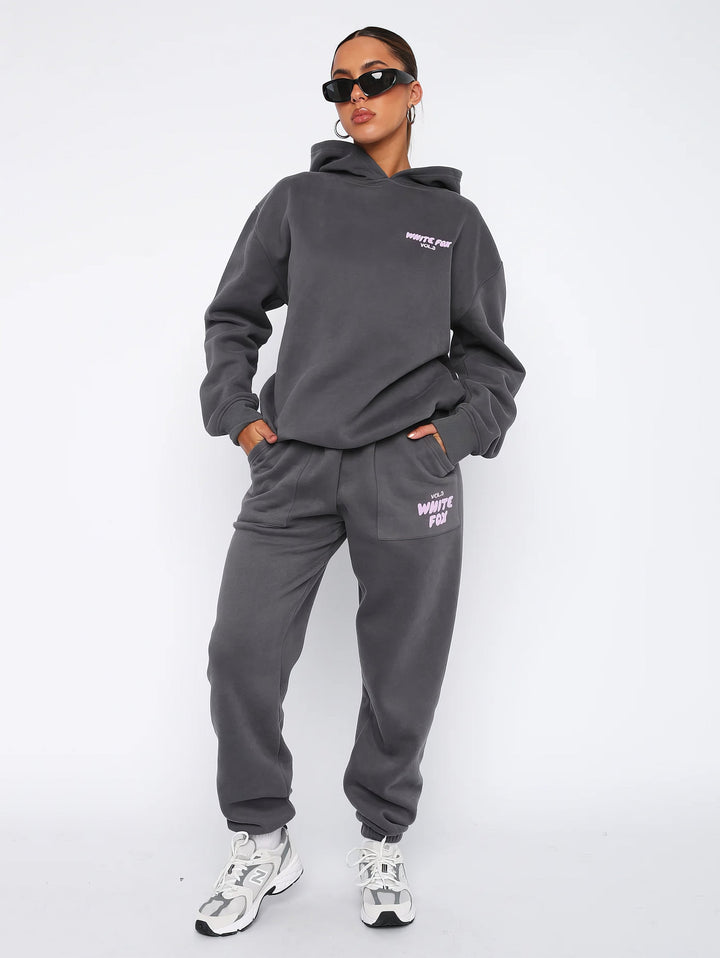 Details: Bequeme Damen Jogginghose des Freizeit-Trainingsanzugs mit Taschen und Bündchen.