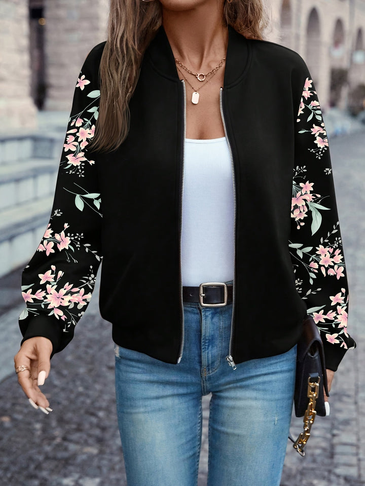 Trendige Damen Bomberjacke mit floralem Ärmel-Design, ideal für einen stylischen Freizeit-Look.