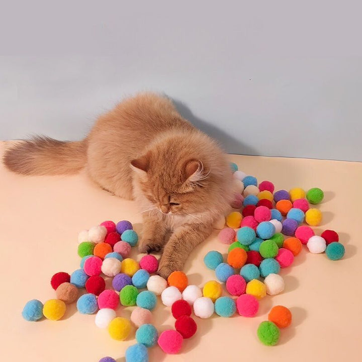 Bunte interaktive Spielzeug-Kanone für Katzen. Ideales Katzenzubehör zur Aktivierung von Jagdinstinkt.
