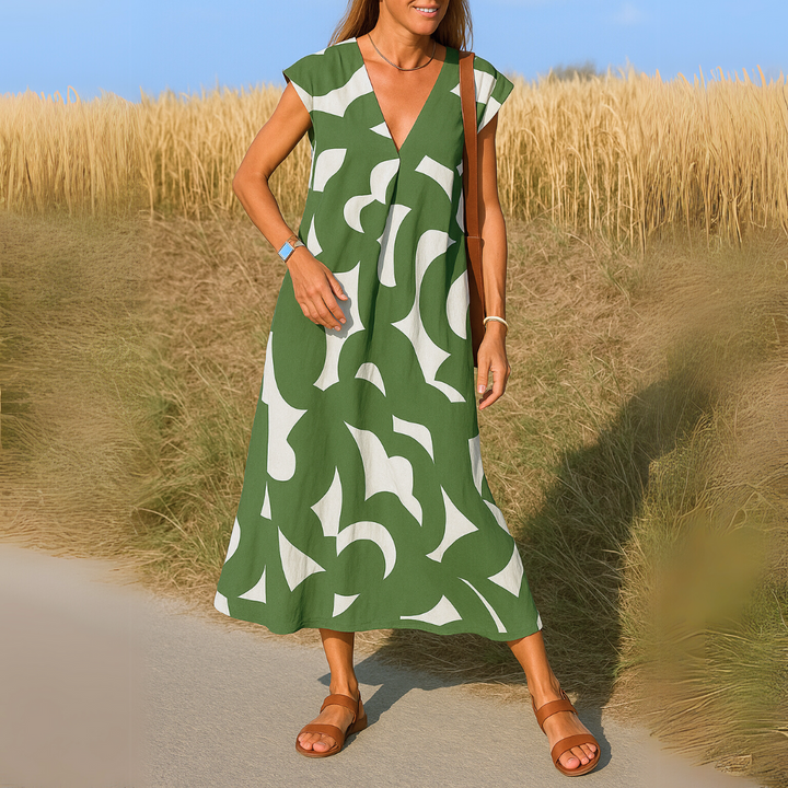 Elegantes Damen Sommerkleid, A-Linien Maxikleid mit grafischem Print und tiefem V-Ausschnitt.