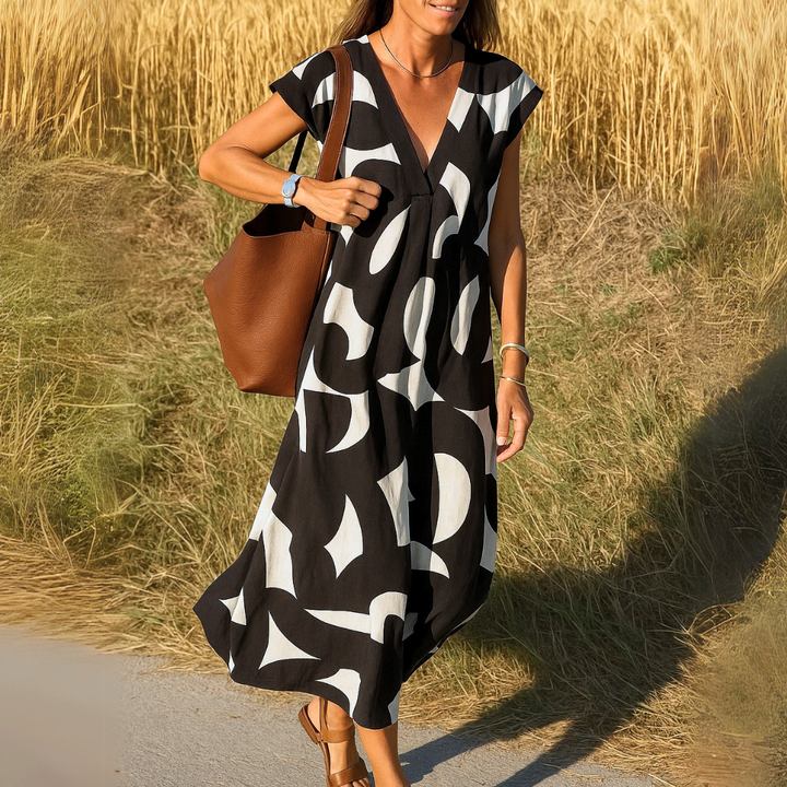 Damen V-Ausschnitt Maxikleid mit grafischem Print in A-Linie, perfekt für Frühjahr & Sommer.