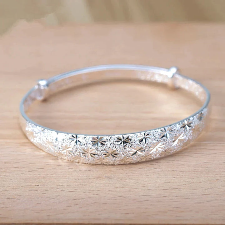Damenarmband aus echtem 925er Silber mit Sternen, glänzend und größenverstellbar, moderner Damenschmuck.