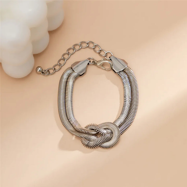 Glänzendes, geknotetes Schlangenkettenarmband für Damen, Gold- & Silber-Finish, eleganter Armschmuck.