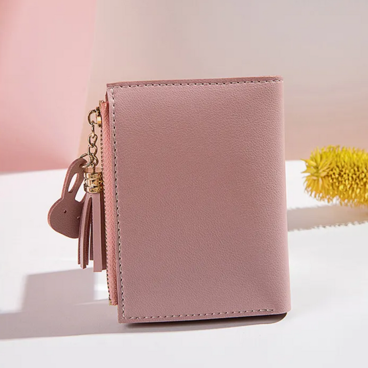 Klein und fein: Damen Faltbrieftasche mit Quasten-Reißverschluss, ideal als Geschenkidee für Frauen.