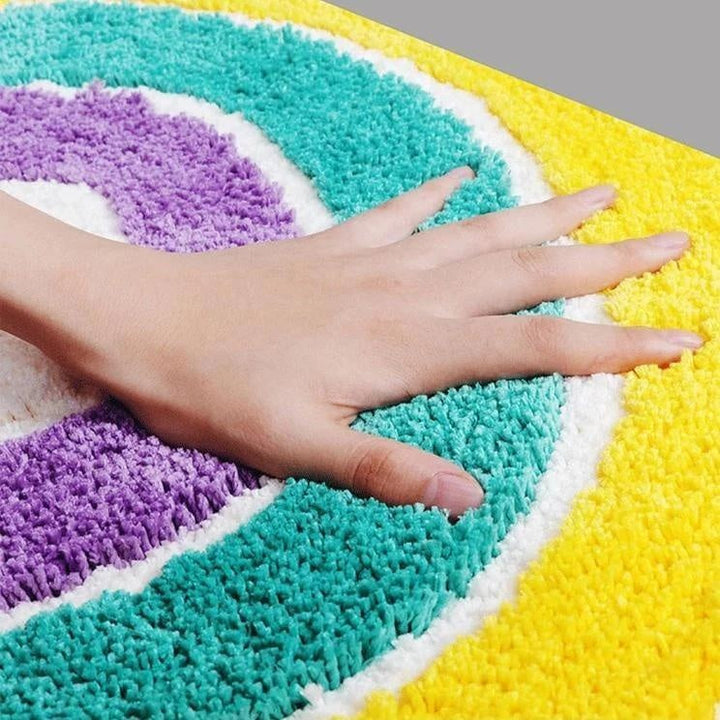 Dekorative Badezimmermatte: Regenbogen-Design. Praktisch, saugfähig und rutschfest für Komfort und Sicherheit.