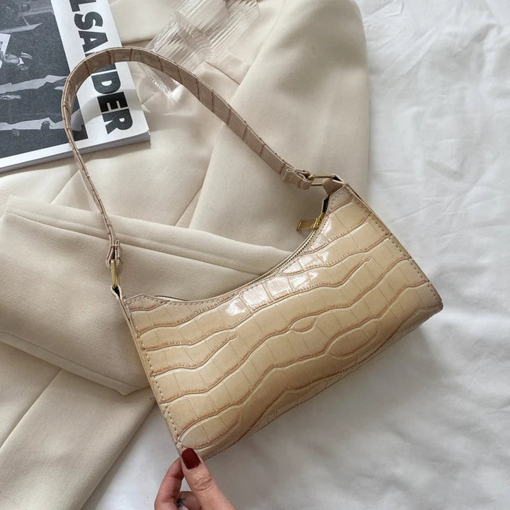 Elegante Damen Schultertasche im Retro-Look, chic und geräumig, in modischem Grau gehalten.