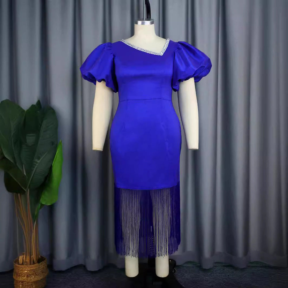 Festliches Damen Cocktailkleid in Blau mit Puffärmeln und Fransen. Ideal für Partys.