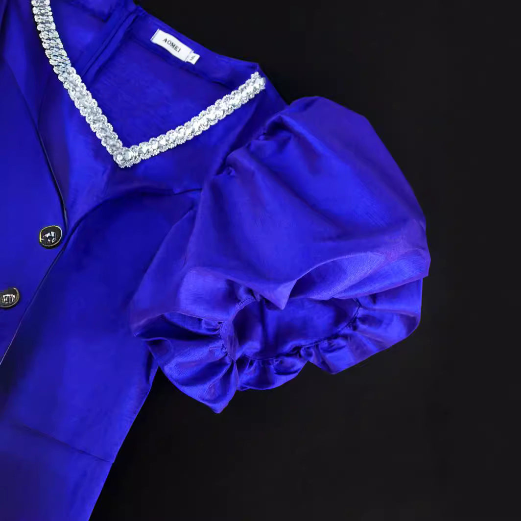 Trendiges blaues Abendkleid für Damen mit auffälligen Puffärmeln & stilvollem Fransen Saum.