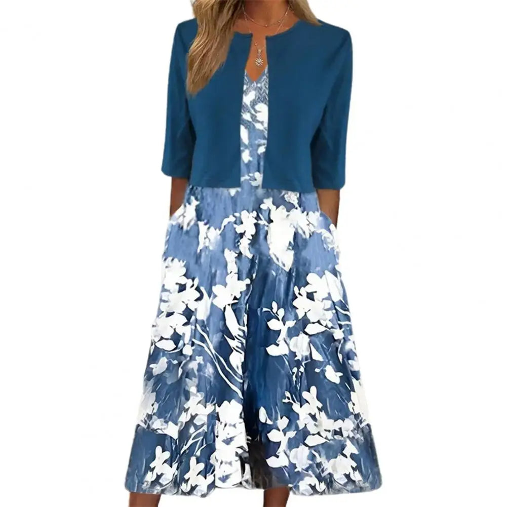 Stylisches Damen Blumenprint-Midikleid mit praktischen Seitentaschen und Halbarm. Perfekt als bequemes Freizeitkleid für Frühling.