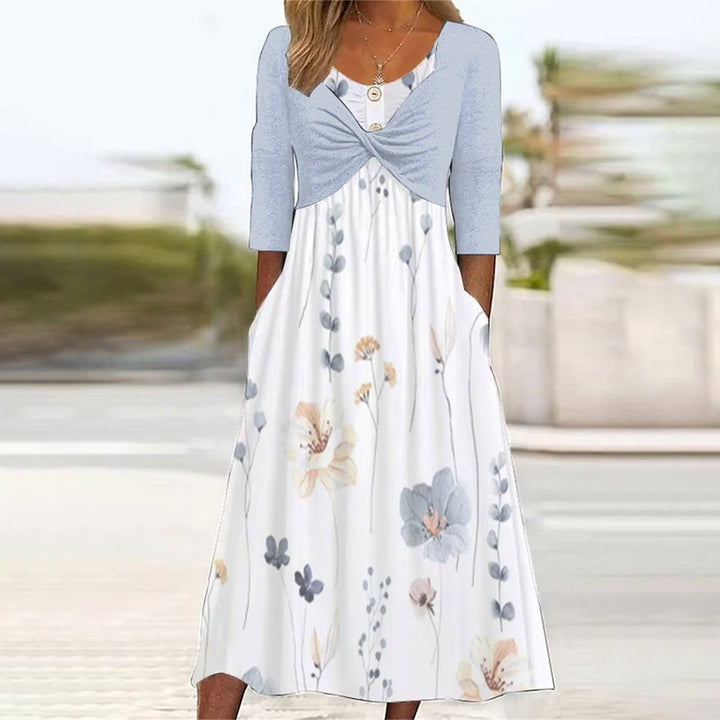 Damen Midikleid mit Blumenprint, A-Linie, Halbarm und praktischen Seitentaschen. Ideal als Sommer- oder Freizeitkleid.