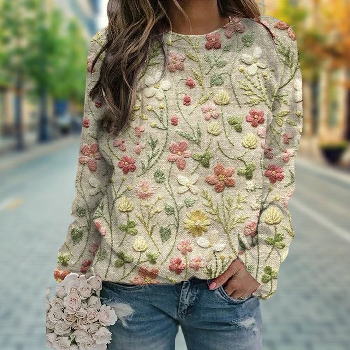 Damen-Freizeitpullover mit ansprechendem Blumenmuster. Komfortabler Langarmpullover, perfekt für entspannte Damenmode.