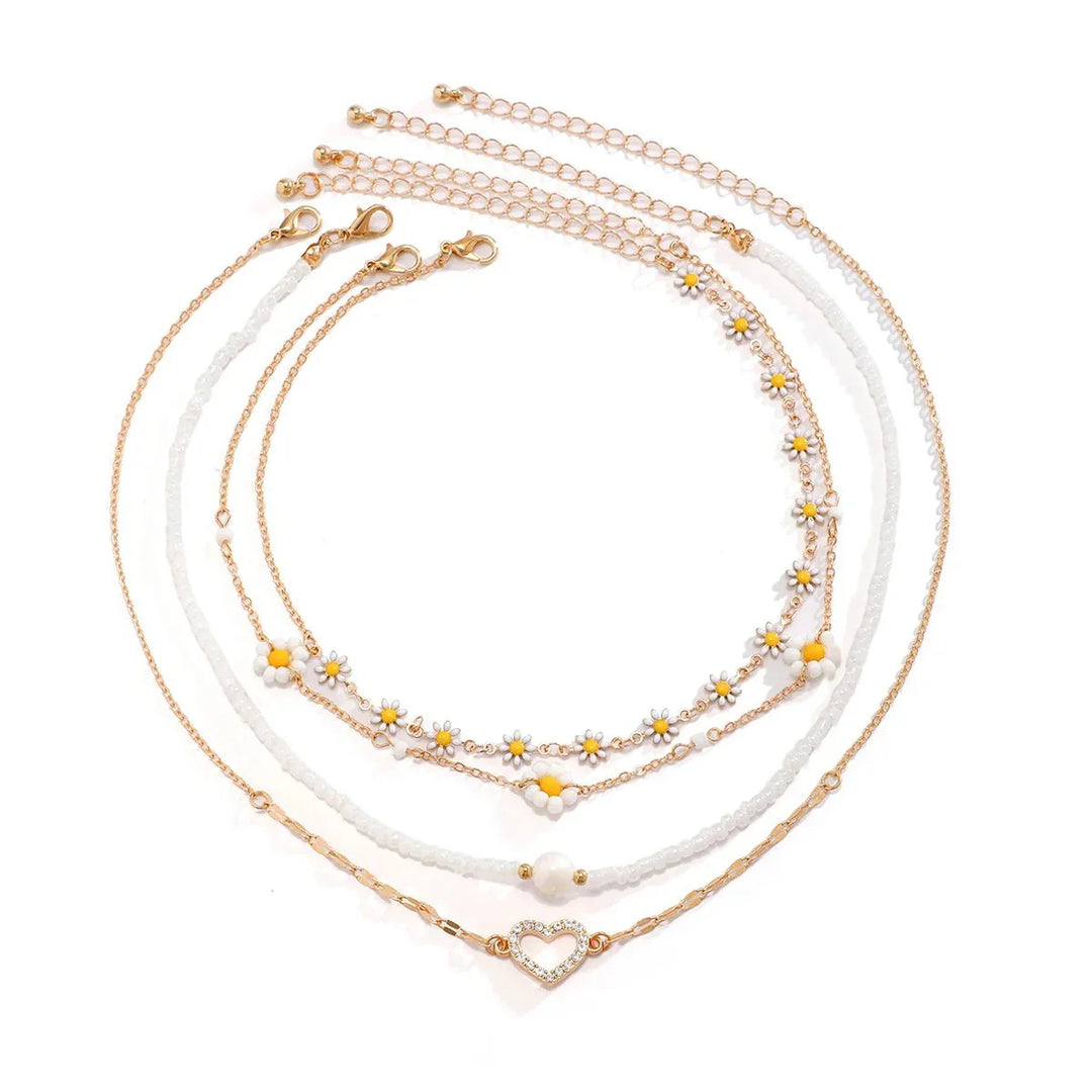 Vielseitiges Damen Boho Halsketten-Set mit Gänseblümchen-Design, ergänzt mit eleganten Perlen.