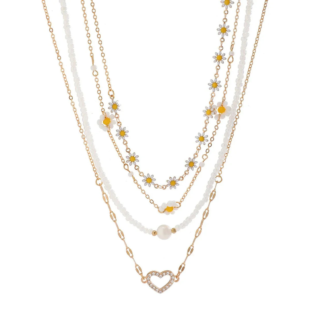 Frühlingshaftes Damen Schmuckset: Boho Gänseblümchen Halsketten aus Edelstahl mit dezenten Perlen.