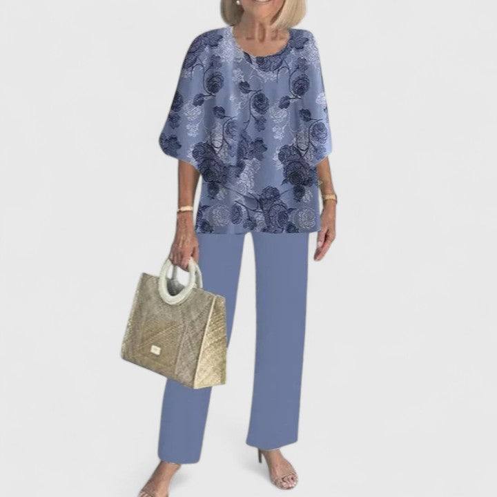 Model präsentiert schickes Damen-Ensemble, komplettiert den eleganten Look mit Accessoires.