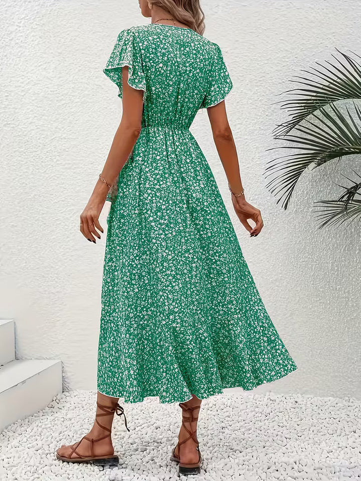 Bequemes Damen Maxikleid mit Wickeldetail, fließend und bauchumspielend, ideal für heiße Tage.