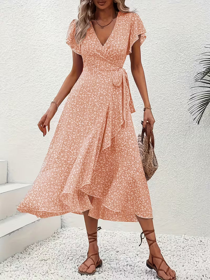 Feminin-elegantes Wickelkleid für Damen, fließend, bauchumspielend, perfekt für den Sommer.
