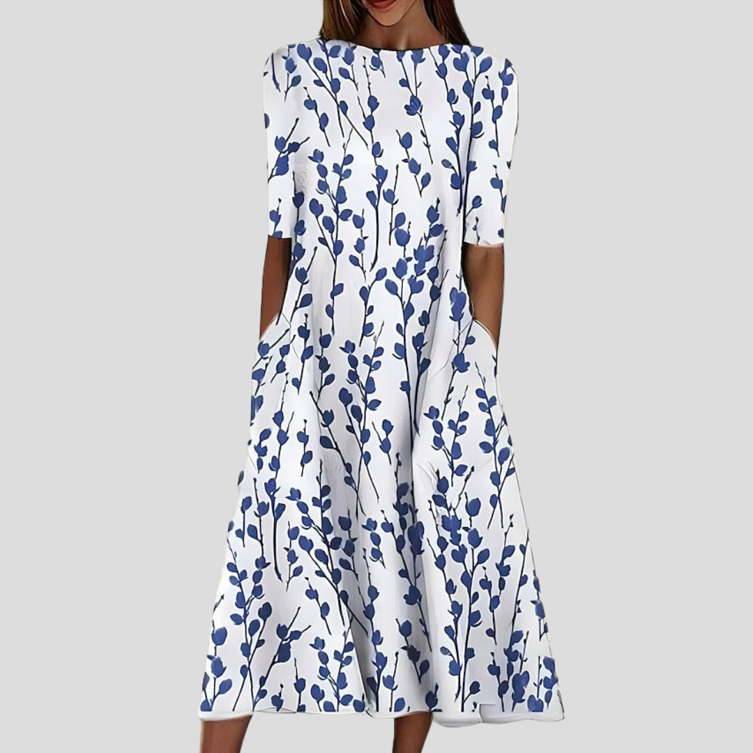 Damen Küstenblumen Midi Kleid mit elegantem Blumenmuster, leicht und fließend, ideal als Sommer- oder Urlaubskleid.