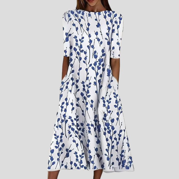 Damen Küstenblumen Midi Kleid mit elegantem Blumenmuster, leicht und fließend, ideal als Sommer- oder Urlaubskleid.