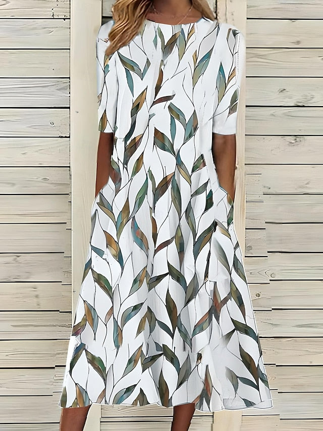 Elegantes Damen Kurzarm Midi Kleid mit Rundhals und floralem Küstenblumen-Muster, schick als Strand- oder Freizeitkleid.