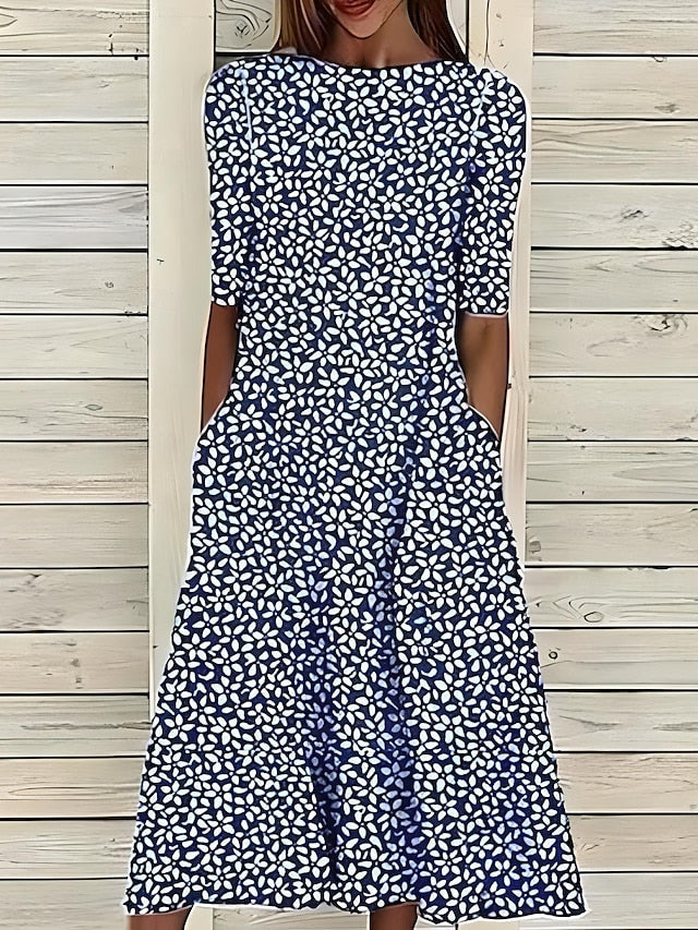 Damen Midi Küstenblumenkleid mit lebhaftem Blumenmuster, fließend und bequem, perfekt für Sommerurlaub oder Strand.