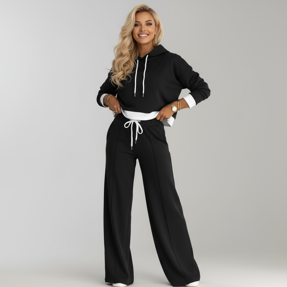Bequemes Damen Freizeit Set: Hausanzug mit Kapuzenpullover und weiter Hose, ideal für entspannte Stunden zu Hause.