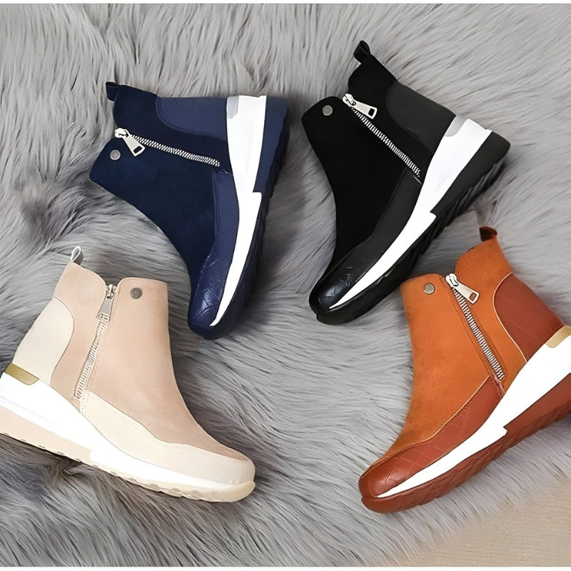 Dame trägt bequeme, orthopädische Stiefeletten, elegant & stilvoll, ideal für Herbsttage.