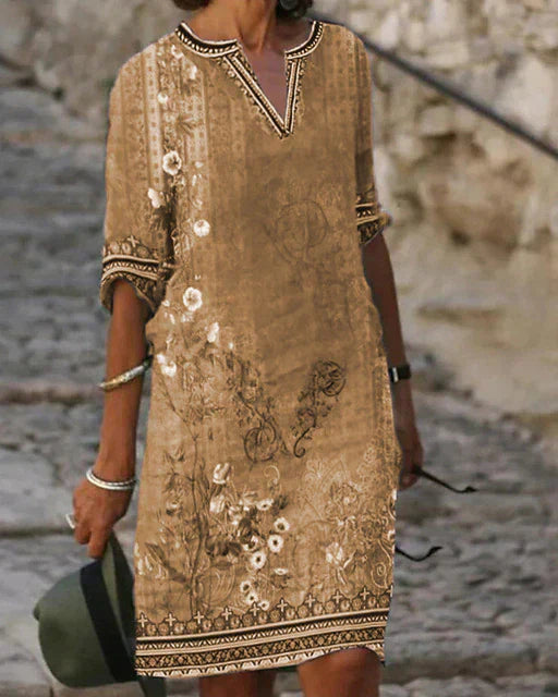 Elegantes Damen-Minikleid im Retro-Stil mit farbenfrohem Blumendruck, ideal als leichtes Sommerkleid.