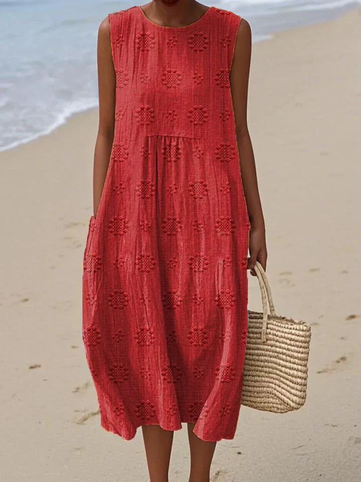 Stylisches ärmelloses Strandkleid Bella für Damen mit Taschen, perfekt für den Urlaub & entspannte Sommertage.
