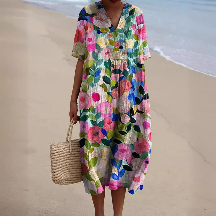 Damen Sommerkleid, lebhaft geblümt, mit V-Ausschnitt. Modisches Freizeitkleid für Frühling und Sommer.