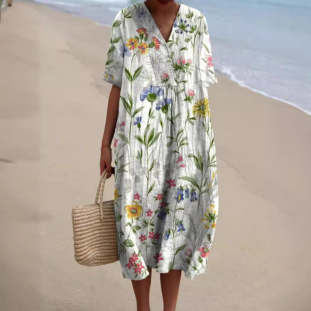 Kurzärmliges Damen Alltagskleid mit buntem Blumenmuster und bequemem V-Ausschnitt. Ideal für Urlaub und Strand.