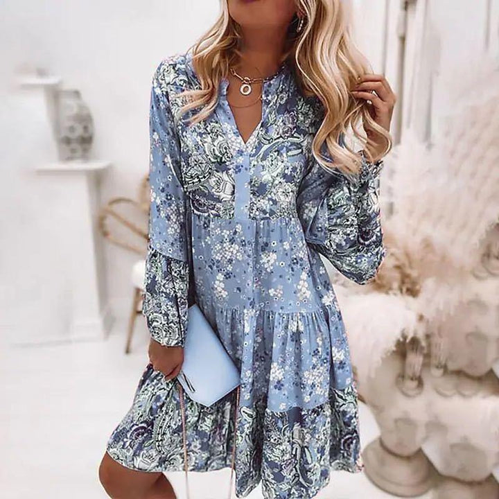 Blumen Sommerkleid: Fließendes Boho-Chic Tunika für Damen, mit lebhaftem Blumenprint und tiefem V-Ausschnitt.